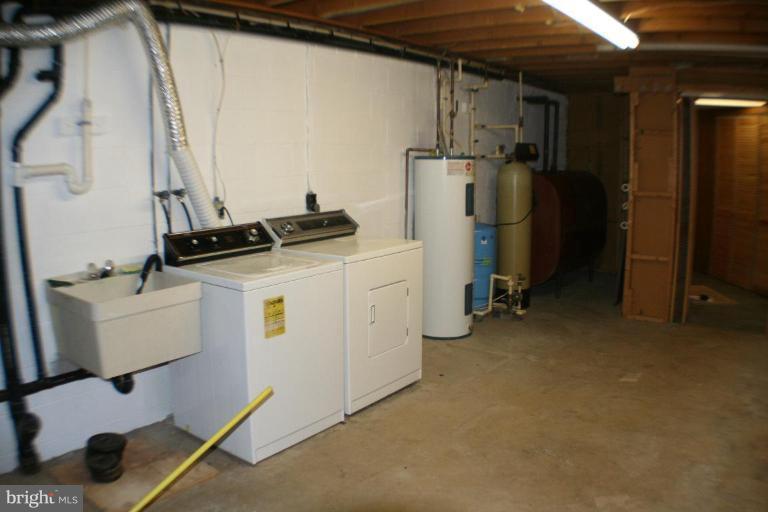 304 Warfieldsburg Road Westminster, MD 21157 - Photo 16 of 19 a room with storage and utility