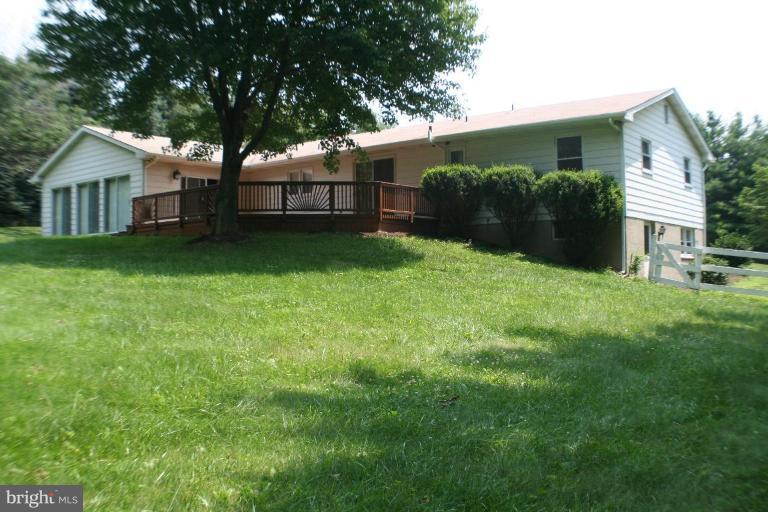 304 Warfieldsburg Road Westminster, MD 21157 - Photo 3 of 19 a view of a house with backyard and garden