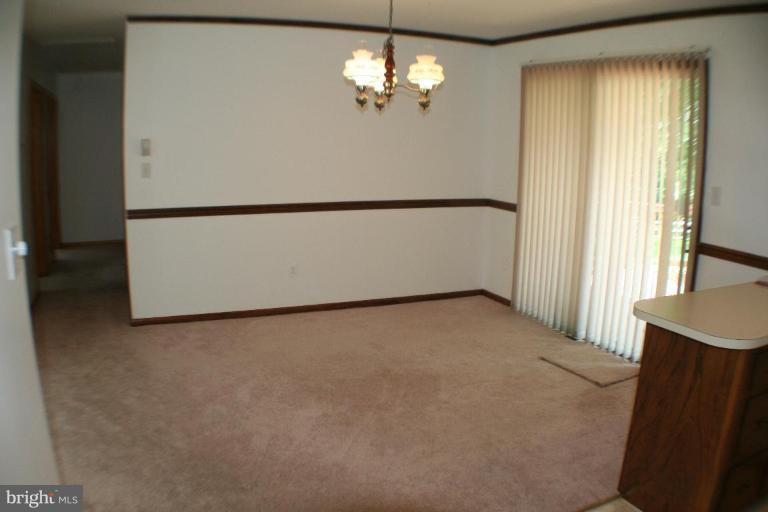304 Warfieldsburg Road Westminster, MD 21157 - Photo 9 of 19 a view of a livingroom with a ceiling fan and window