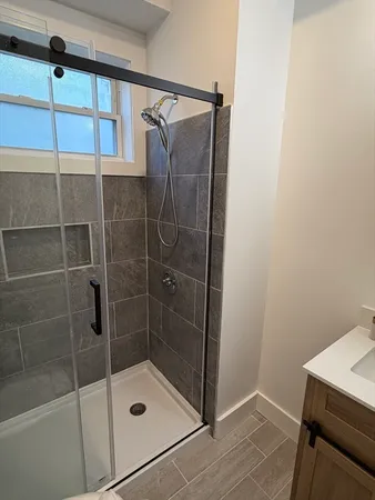 a bathroom with a shower and toilet