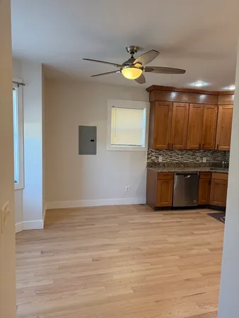 a view of kitchen with microwave and cabinets