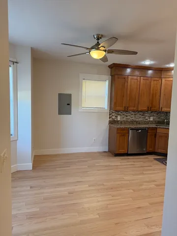 a view of kitchen with microwave and cabinets
