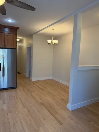 a view of a livingroom with wooden floor