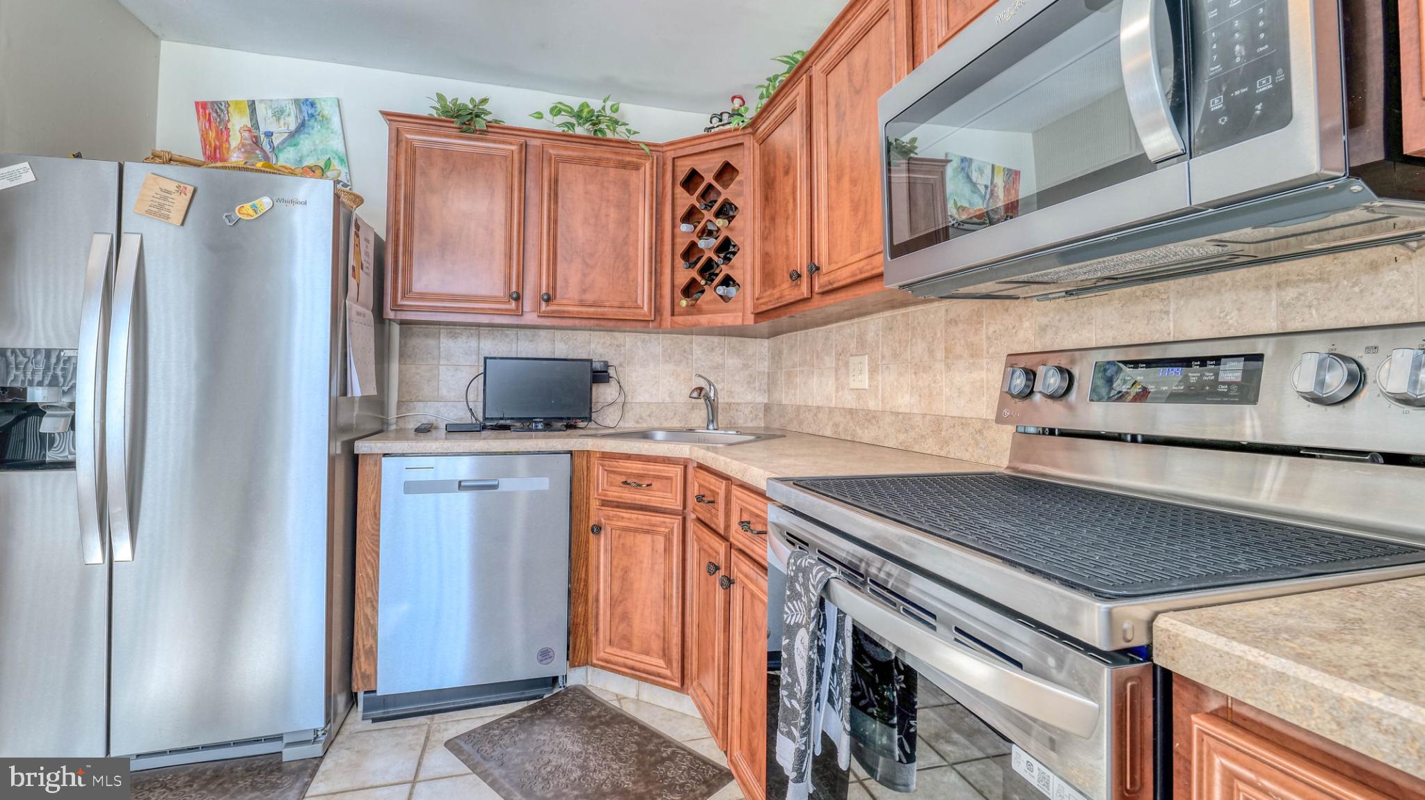 2606 Boulder Court Mays Landing, NJ 08330 - Photo 11 of 13 Modern kitchen with warm wood cabinetry.