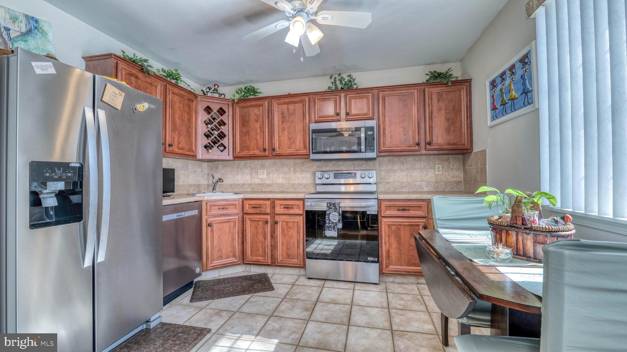 2606 Boulder Court Mays Landing, NJ 08330 - Photo 9 of 13 Modern kitchen with warm wood cabinetry.