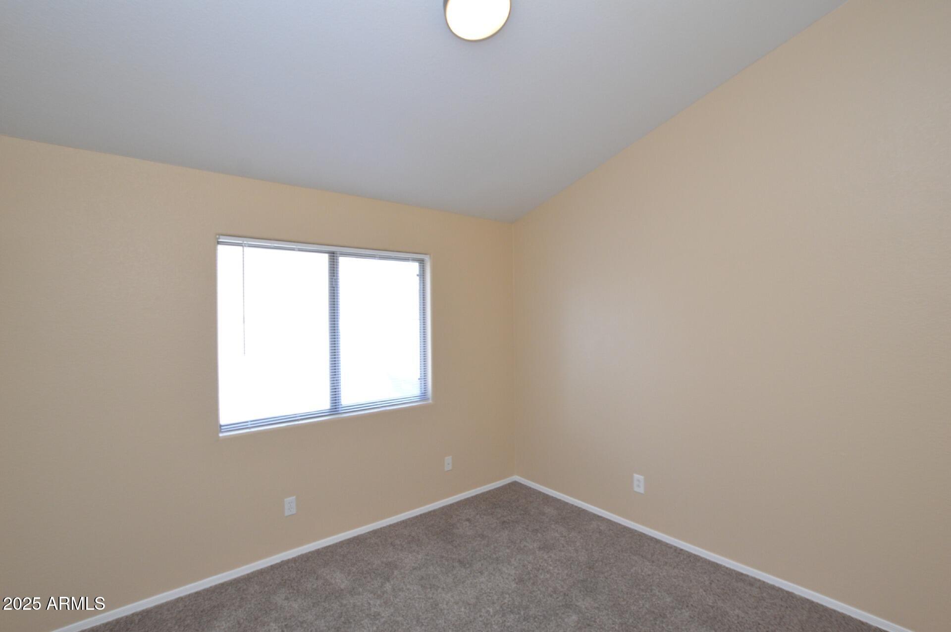 4094 East Rustler Way Gilbert, AZ 85297 - Photo 14 of 34 an empty room with windows