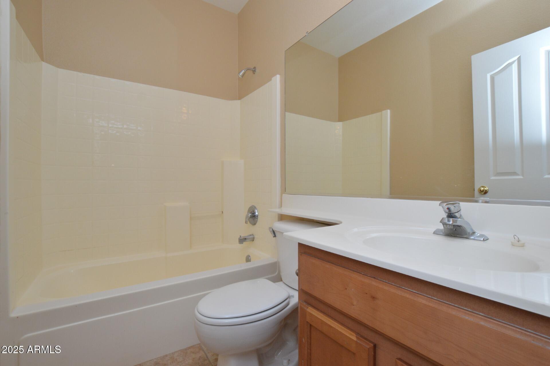 4094 East Rustler Way Gilbert, AZ 85297 - Photo 19 of 34 a bathroom with a sink a toilet and a bathtub