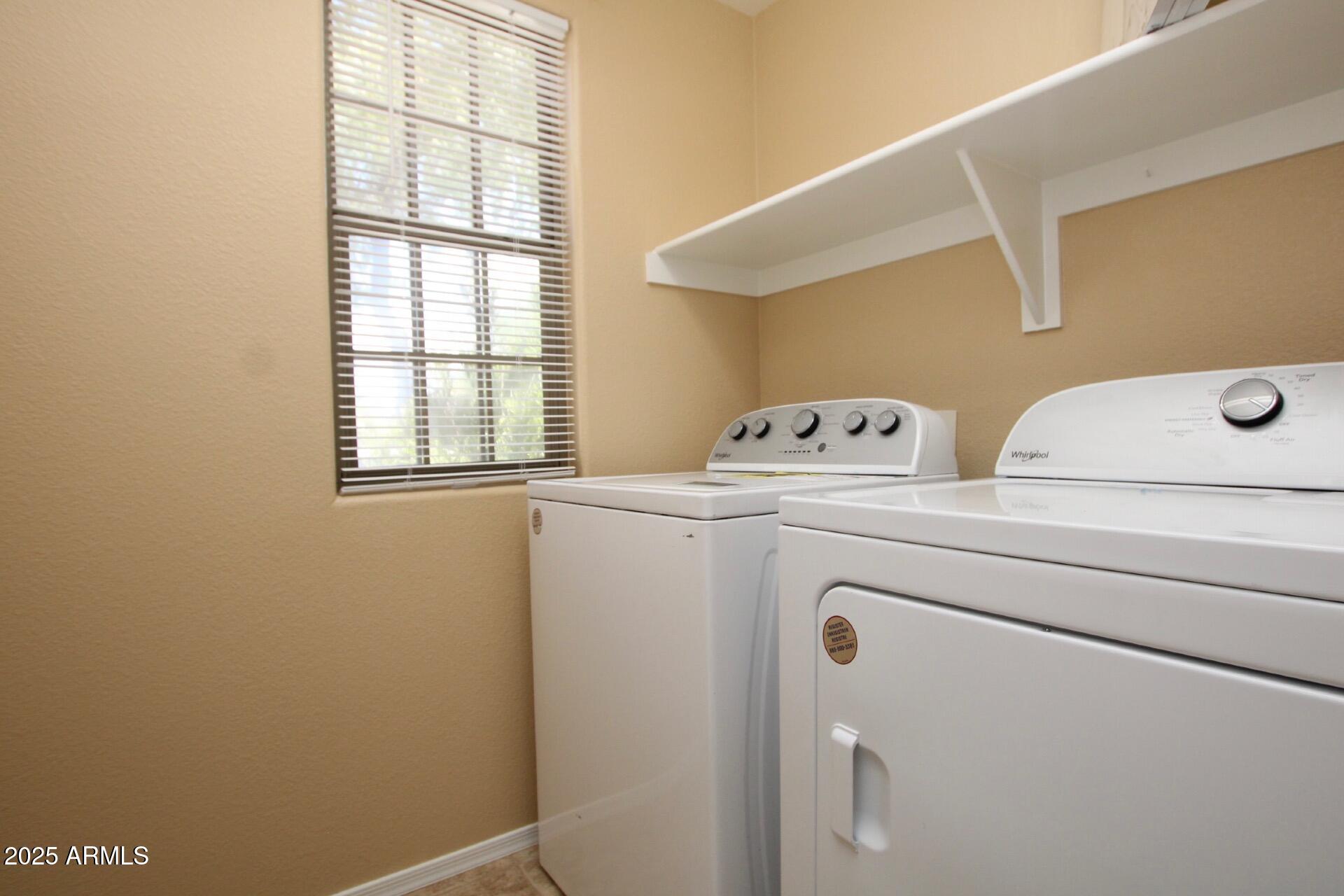 4094 East Rustler Way Gilbert, AZ 85297 - Photo 21 of 34 a utility room with dryer and washer