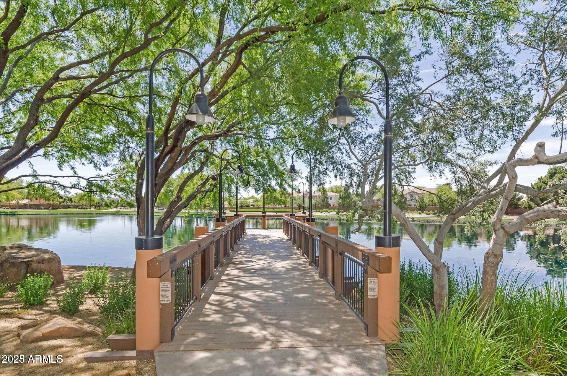 4094 East Rustler Way Gilbert, AZ 85297 - Photo 26 of 34 a view of a pathway of a house next to a lake view