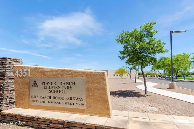 a view of a swimming pool with outdoor seating