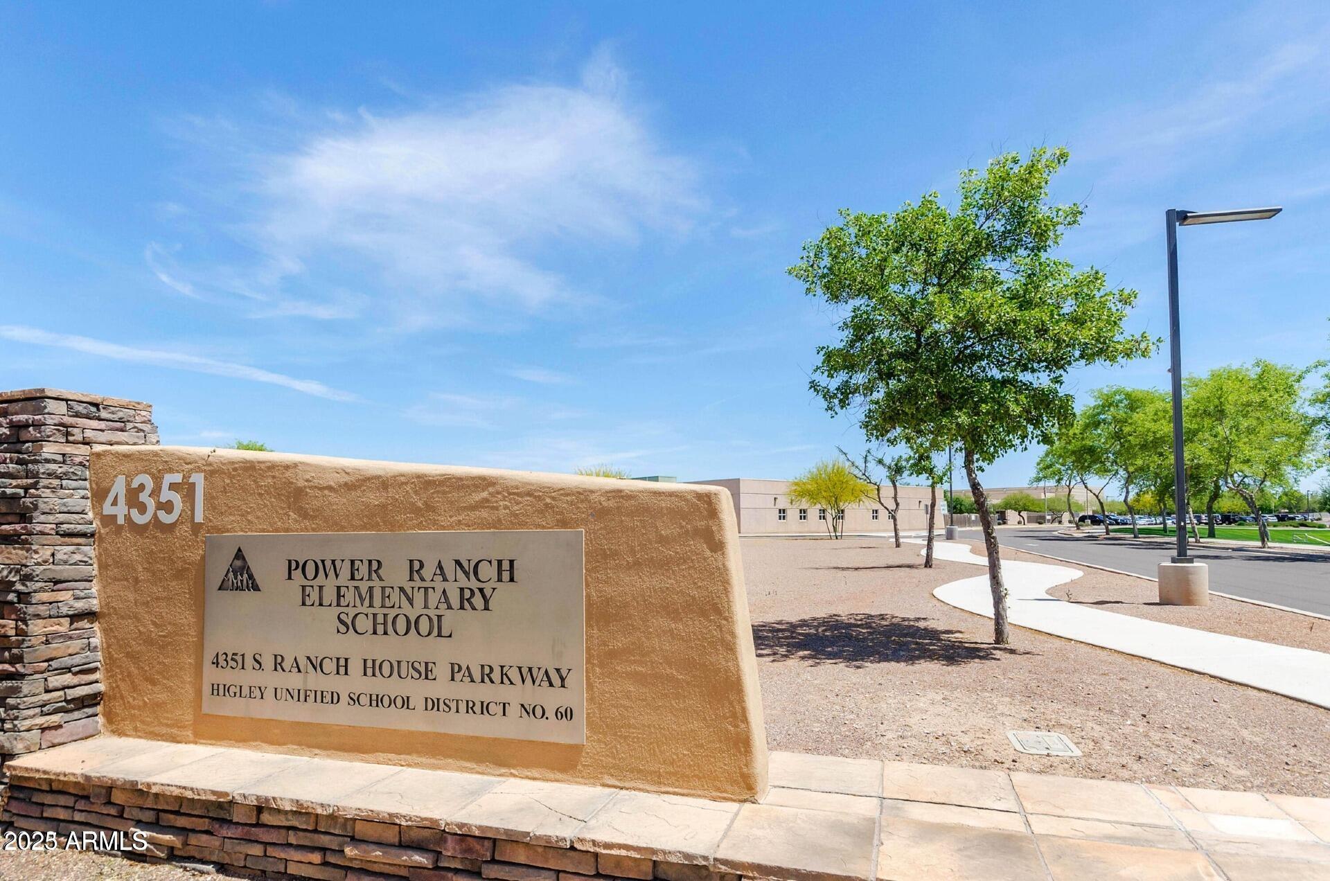 4094 East Rustler Way Gilbert, AZ 85297 - Photo 29 of 34 a sign on the side of a building