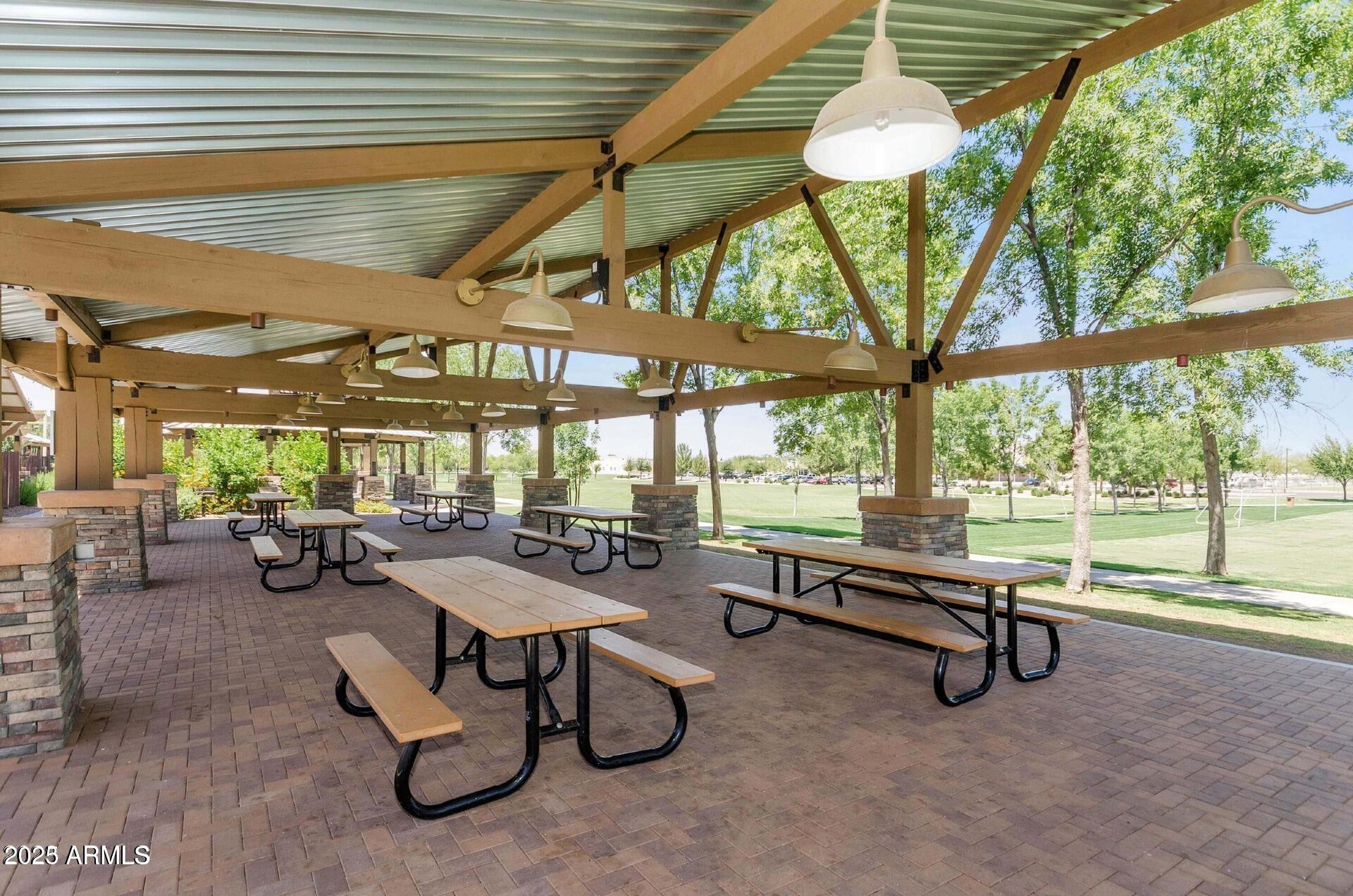 4094 East Rustler Way Gilbert, AZ 85297 - Photo 30 of 34 a view of a swimming pool with outdoor seating