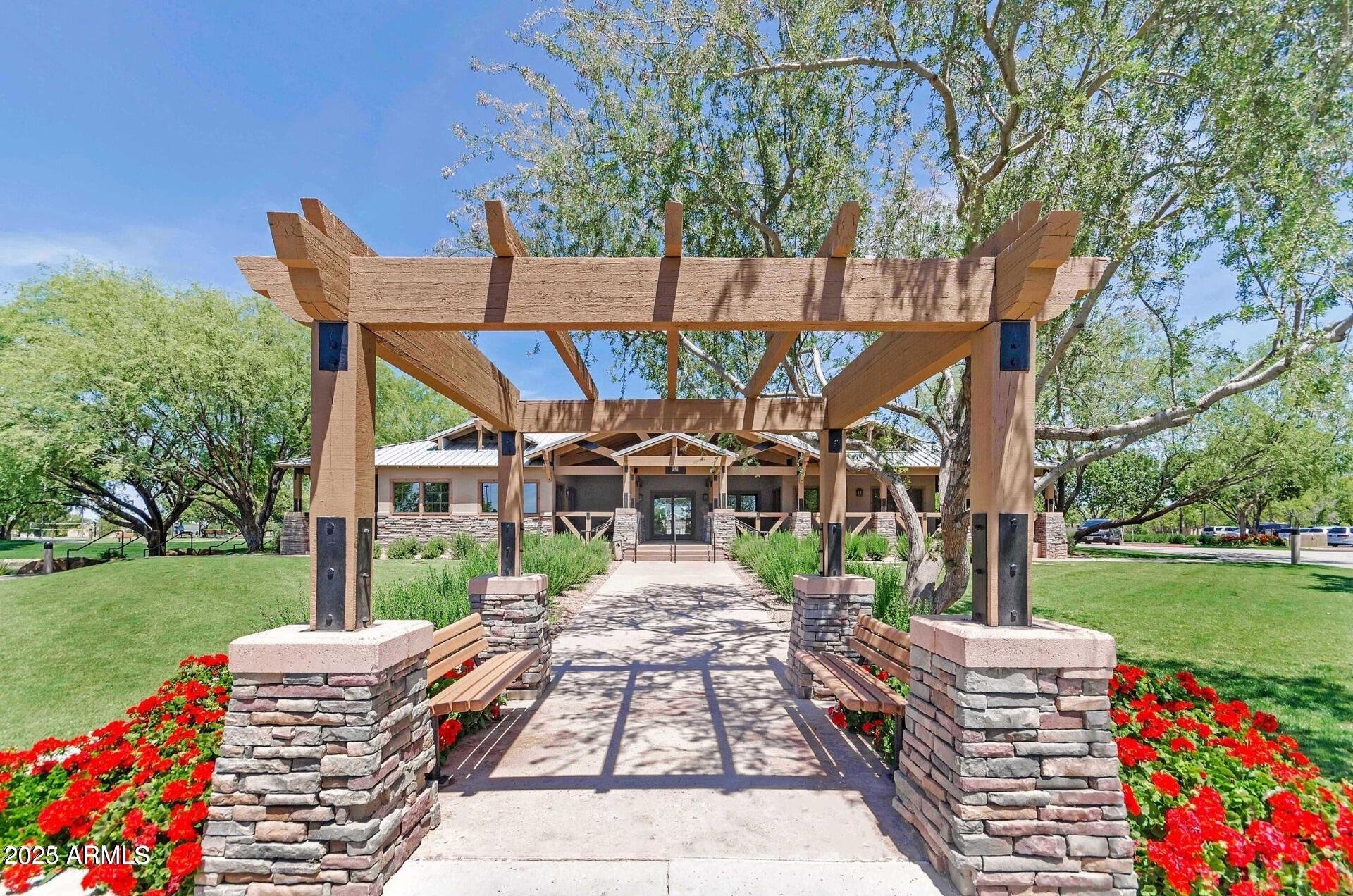 4094 East Rustler Way Gilbert, AZ 85297 - Photo 31 of 34 a front view of a house with garden