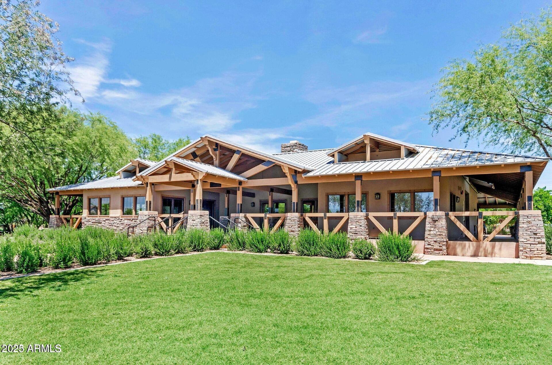 4094 East Rustler Way Gilbert, AZ 85297 - Photo 32 of 34 a front view of a house with garden