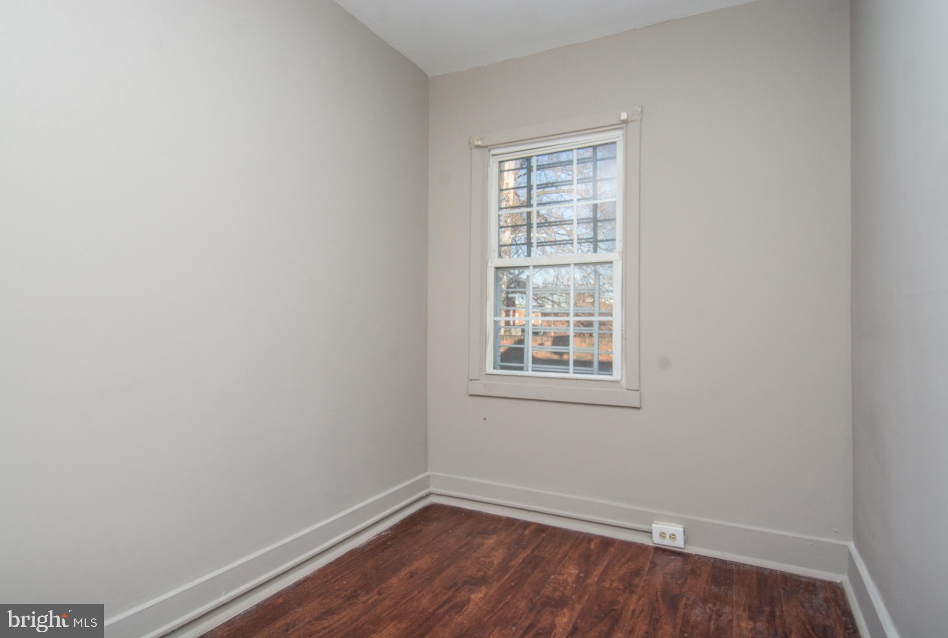 2228 Christian Street Baltimore, MD 21223 - Photo 12 of 16 an empty room with a window