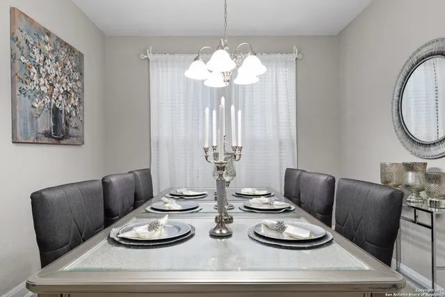 a dining room with furniture and window