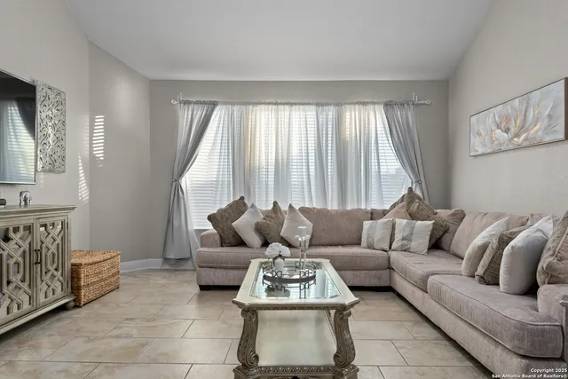 a living room with furniture and a window