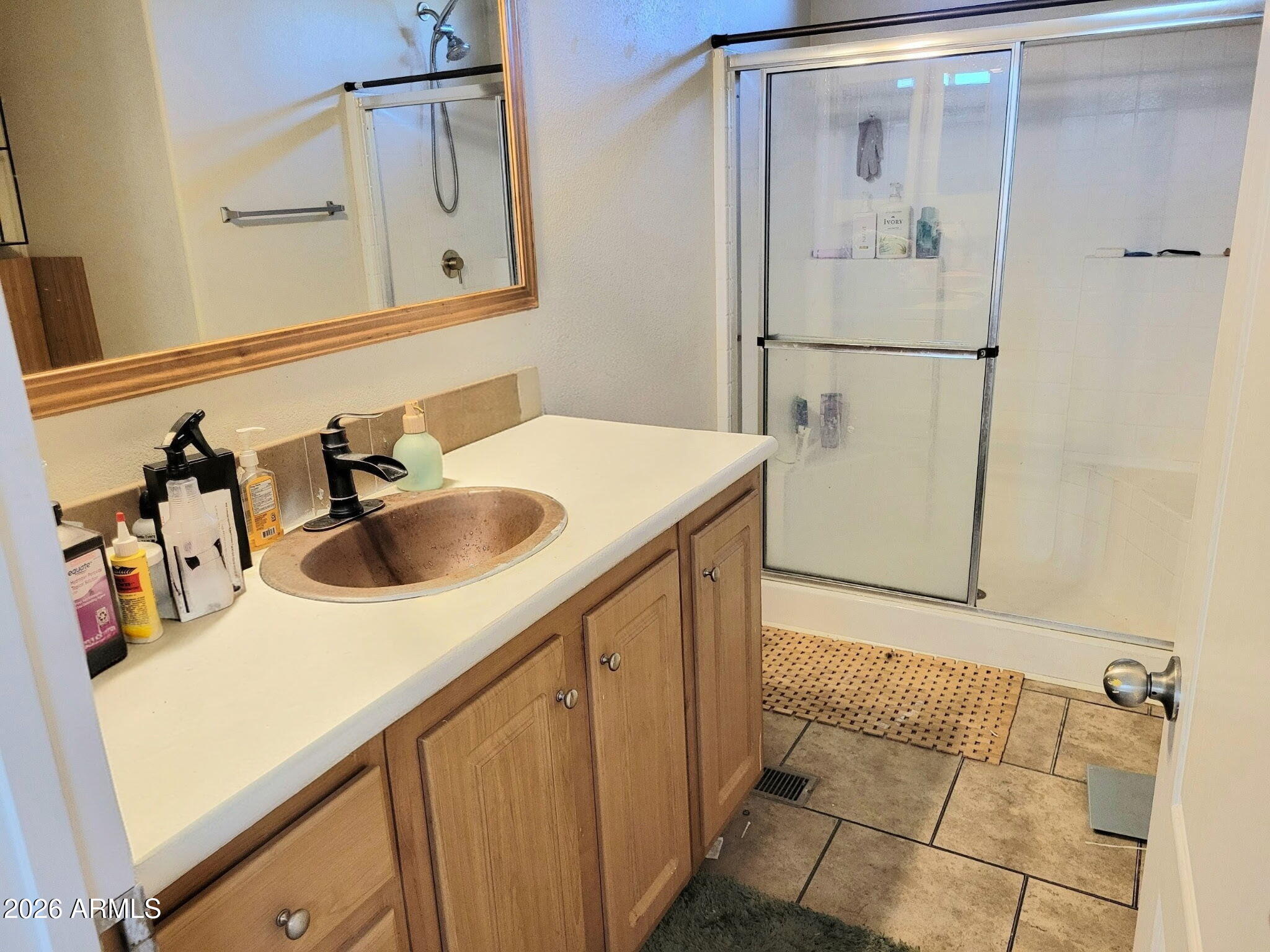 5002 West Bethany Home Road, Unit 33 Glendale, AZ 85301 - Photo 5 of 12 a bathroom with a sink and a mirror