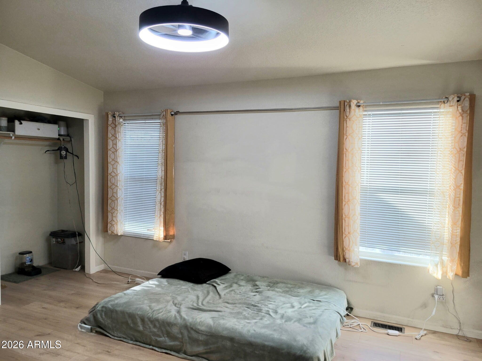 5002 West Bethany Home Road, Unit 33 Glendale, AZ 85301 - Photo 8 of 12 a bedroom with a bed and a window