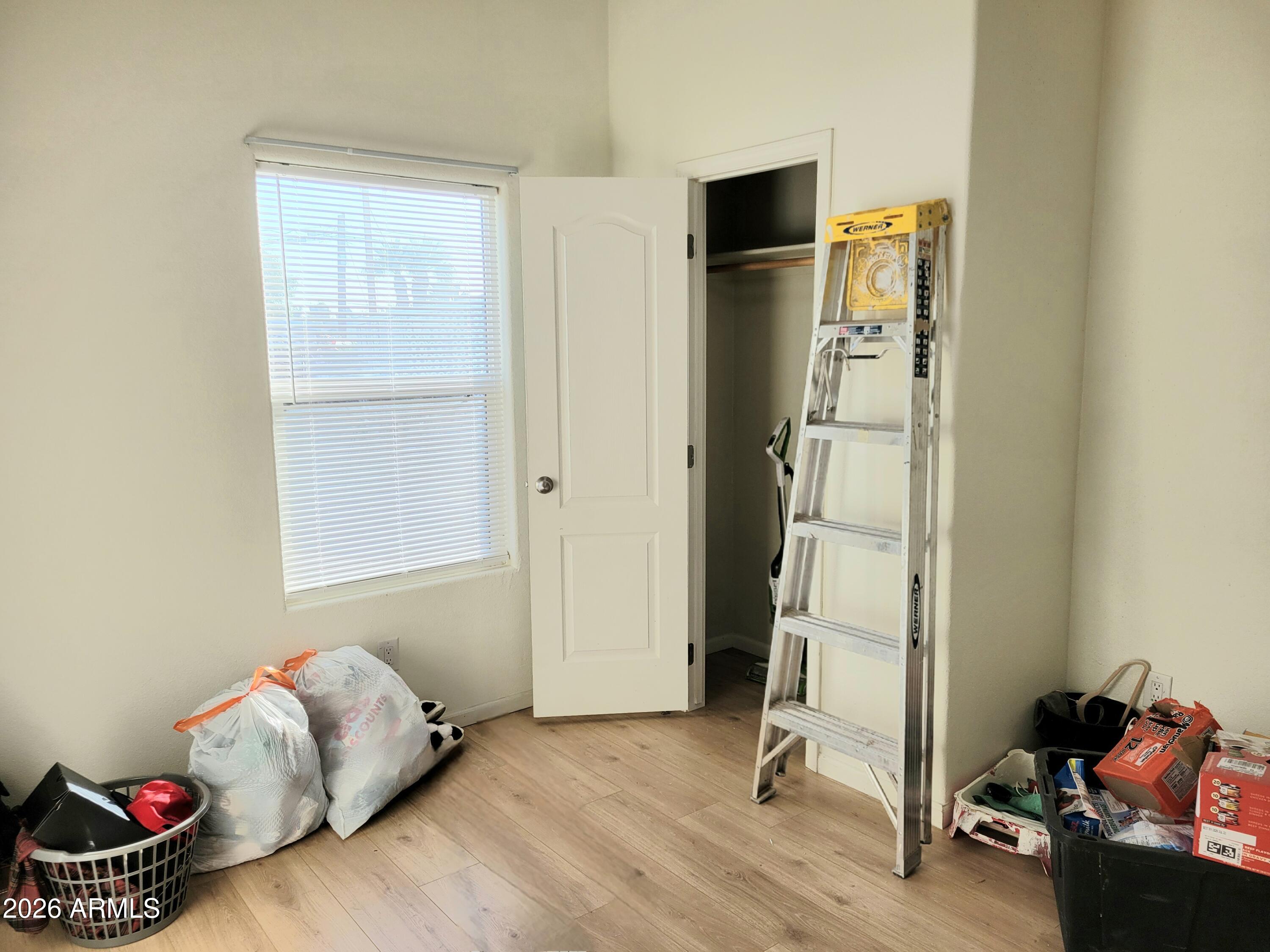 5002 West Bethany Home Road, Unit 33 Glendale, AZ 85301 - Photo 10 of 12 a view of room with toys and wooden floor
