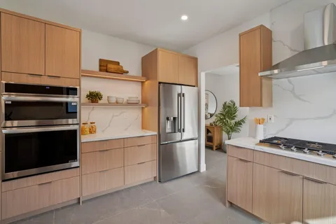 a kitchen with a stove and a microwave