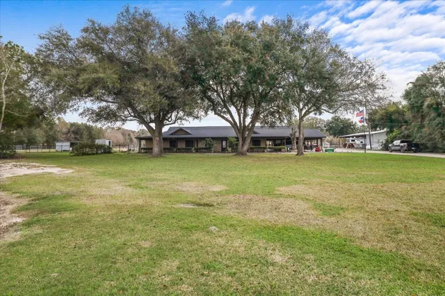 a view of a tree in front of a house