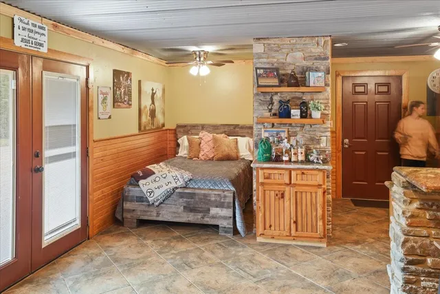 a bathroom with a toilet sink and shower curtain