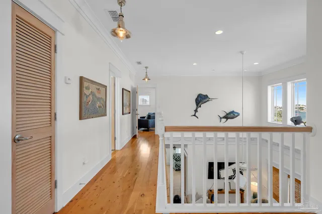 a living room with furniture kitchen view and a window