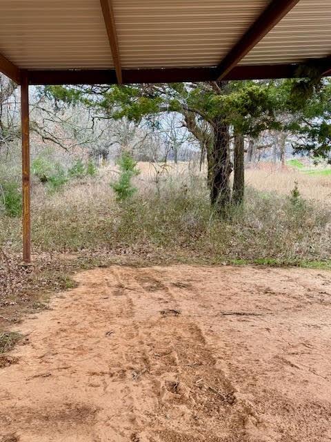 702 County Road 3597 Boyd, TX 76023 - Photo 14 of 19 a backyard of a house with lots of green space