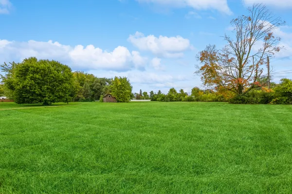a backyard of a house with lots of green space
