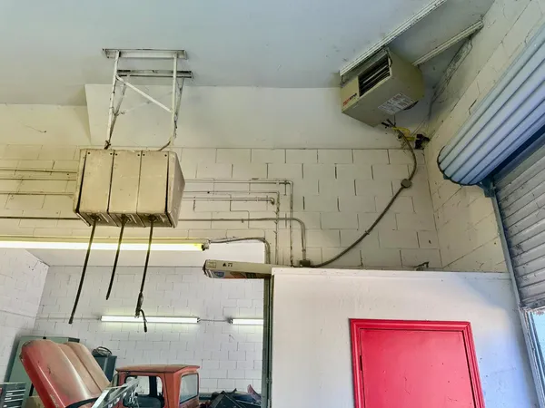 a bed sitting in a room next to a window