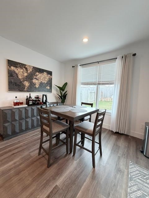 13725 Rising Sun Lane Conroe, TX 77384 - Photo 10 of 29 a dining room with furniture and wooden floor