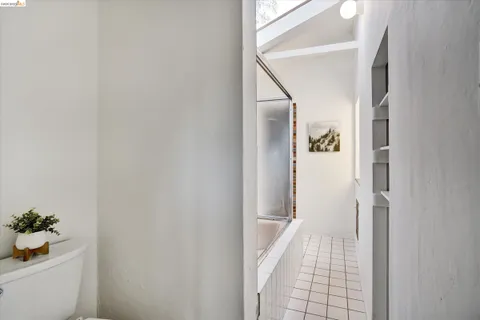 a bathroom with a tub and shower