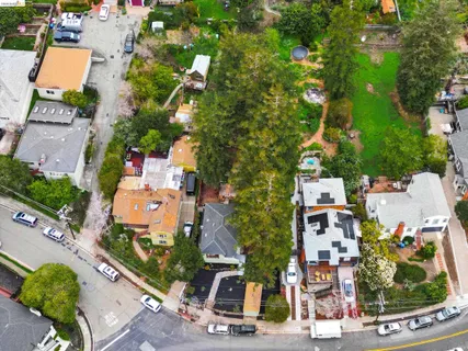an aerial view of residential houses with outdoor space