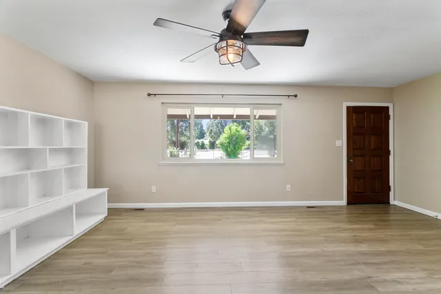 a view of an empty room with a window
