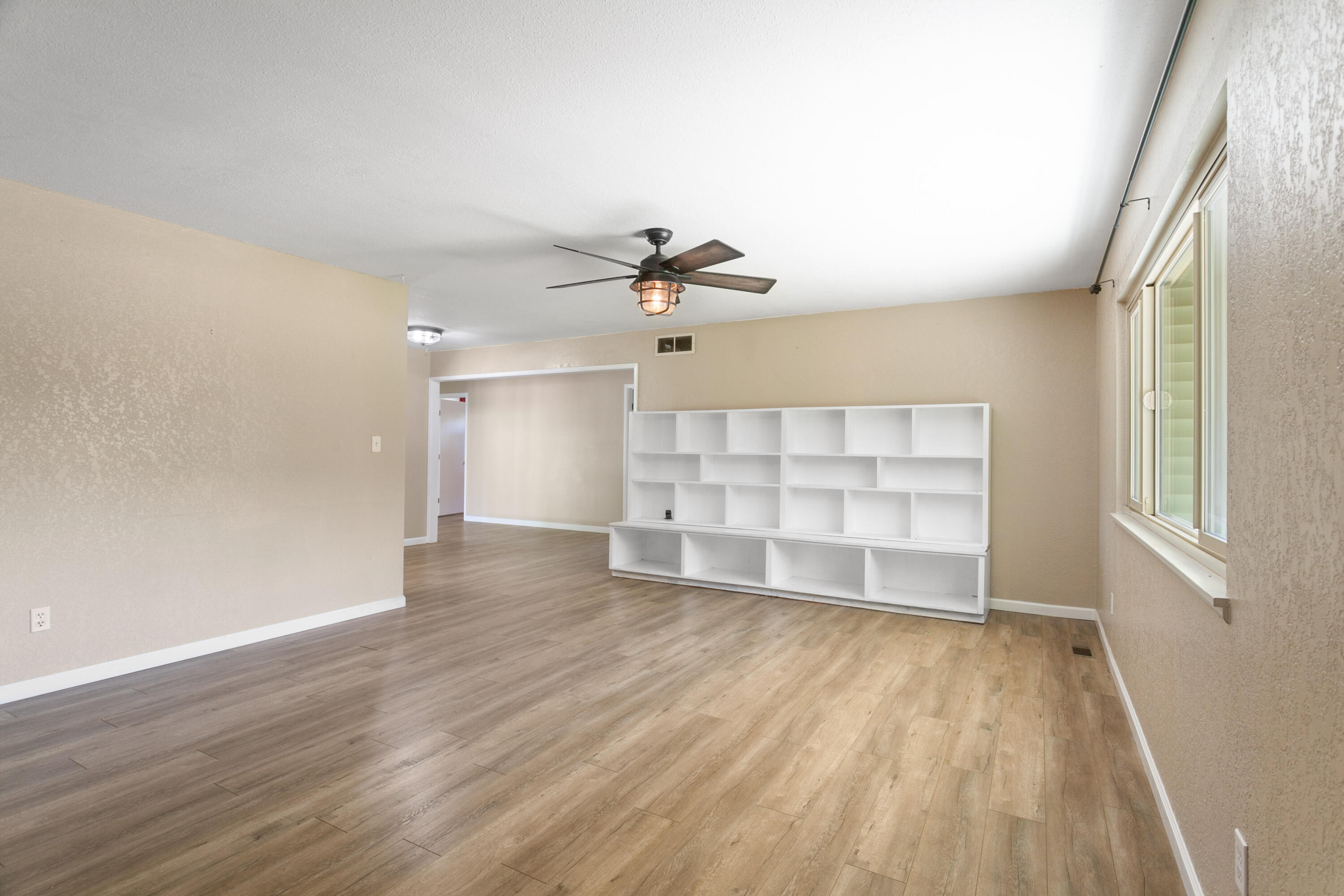 5858 Deschutes Road Anderson, CA 96007 - Photo 5 of 30 wooden floor in an empty room with a window