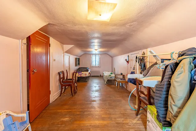a view of a storage room with racks on the wall