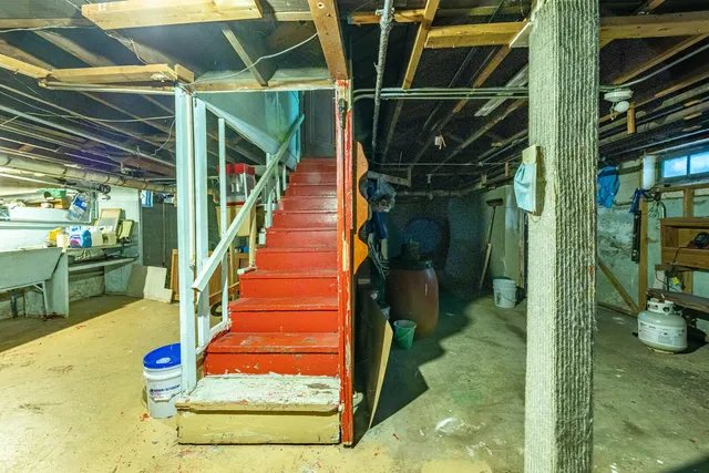 a kitchen with cabinets and wooden floor