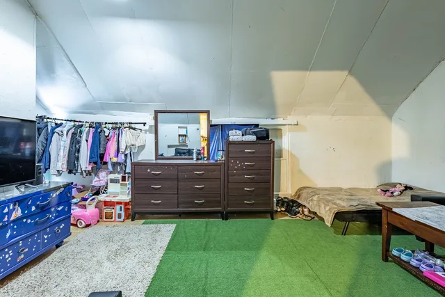 a bedroom with a bed and a bed