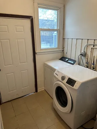 a utility room with dryer and washer
