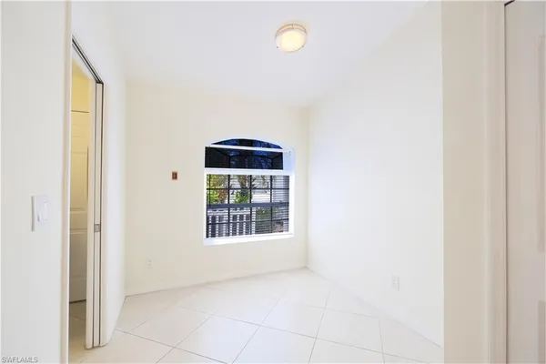 a view of empty room with a fireplace