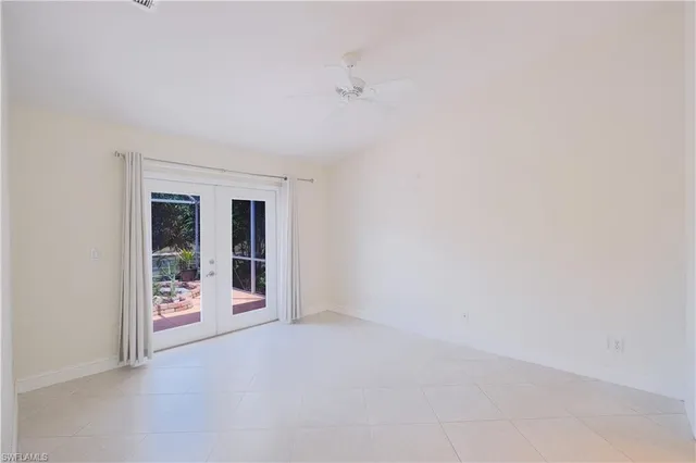 a spacious bathroom with a double vanity sink toilet and a mirror