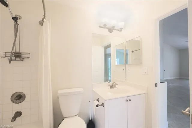 a room with a large window and swimming pool in front of a house