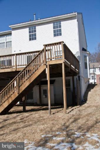 3515 Corn Stream Road Randallstown, MD 21133 - Photo 15 of 23 a view of a house with wooden stairs