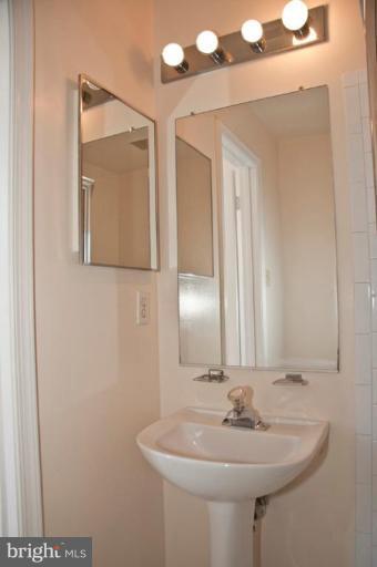 3515 Corn Stream Road Randallstown, MD 21133 - Photo 18 of 23 a bathroom with a sink and a mirror