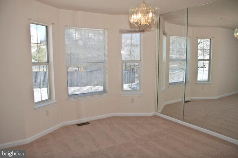 3515 Corn Stream Road Randallstown, MD 21133 - Photo 3 of 23 a view of an empty room with a window