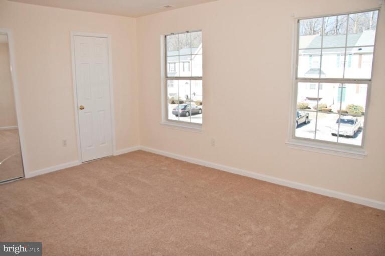 3515 Corn Stream Road Randallstown, MD 21133 - Photo 21 of 23 an empty room with windows