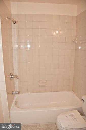 3515 Corn Stream Road Randallstown, MD 21133 - Photo 23 of 23 a bathroom with a shower and a toilet