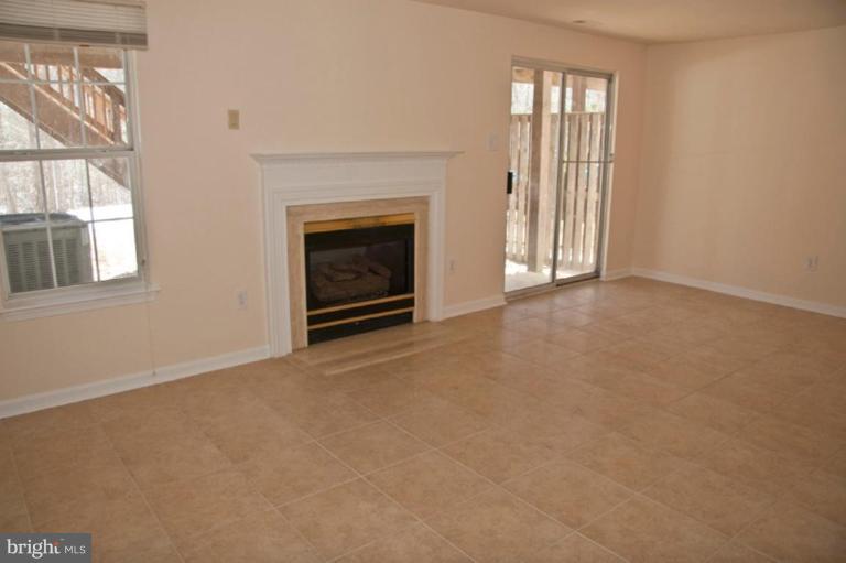3515 Corn Stream Road Randallstown, MD 21133 - Photo 6 of 23 an empty room with windows