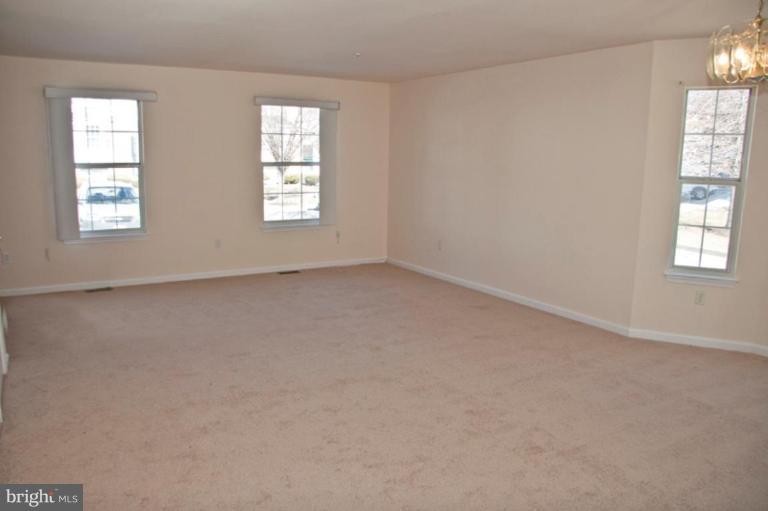 3515 Corn Stream Road Randallstown, MD 21133 - Photo 9 of 23 an empty room with windows